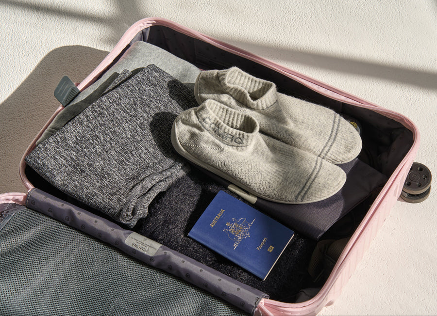 Comfiq cloudstep in a suitcase with clothing and passport